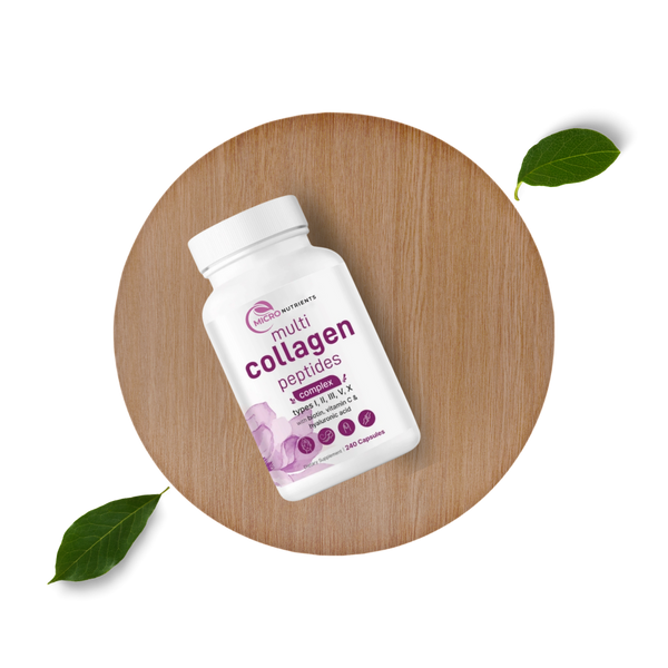 Multicollagen peptides supplement bottle on a wooden board with leaves