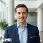 Man in a blue suit standing in an indoor setting with 'Davie' branding.