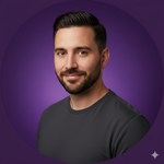 Man with a beard wearing a dark gray shirt on a purple background