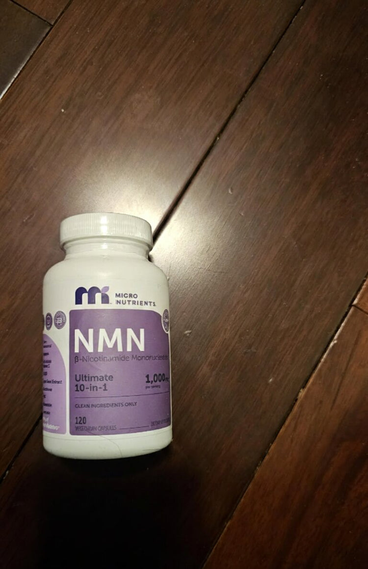NMN supplement bottle on a wooden surface