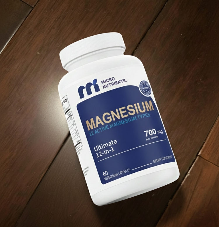 Supplement bottle labeled 'Magnesium' on a wooden surface