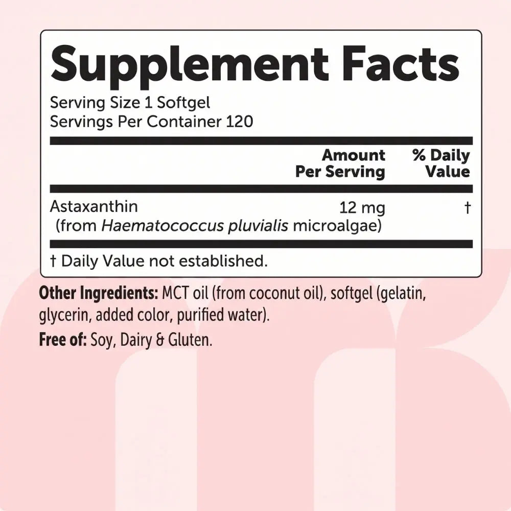 Supplement facts label with astaxanthin content on a pink background