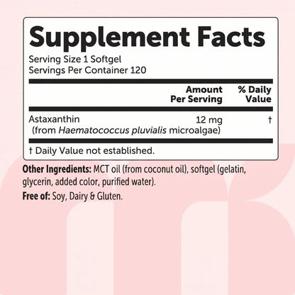 Supplement facts label with astaxanthin content on a pink background