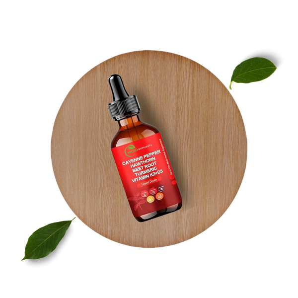 Bottle of cayenne pepper extract on a wooden platform with leaves.