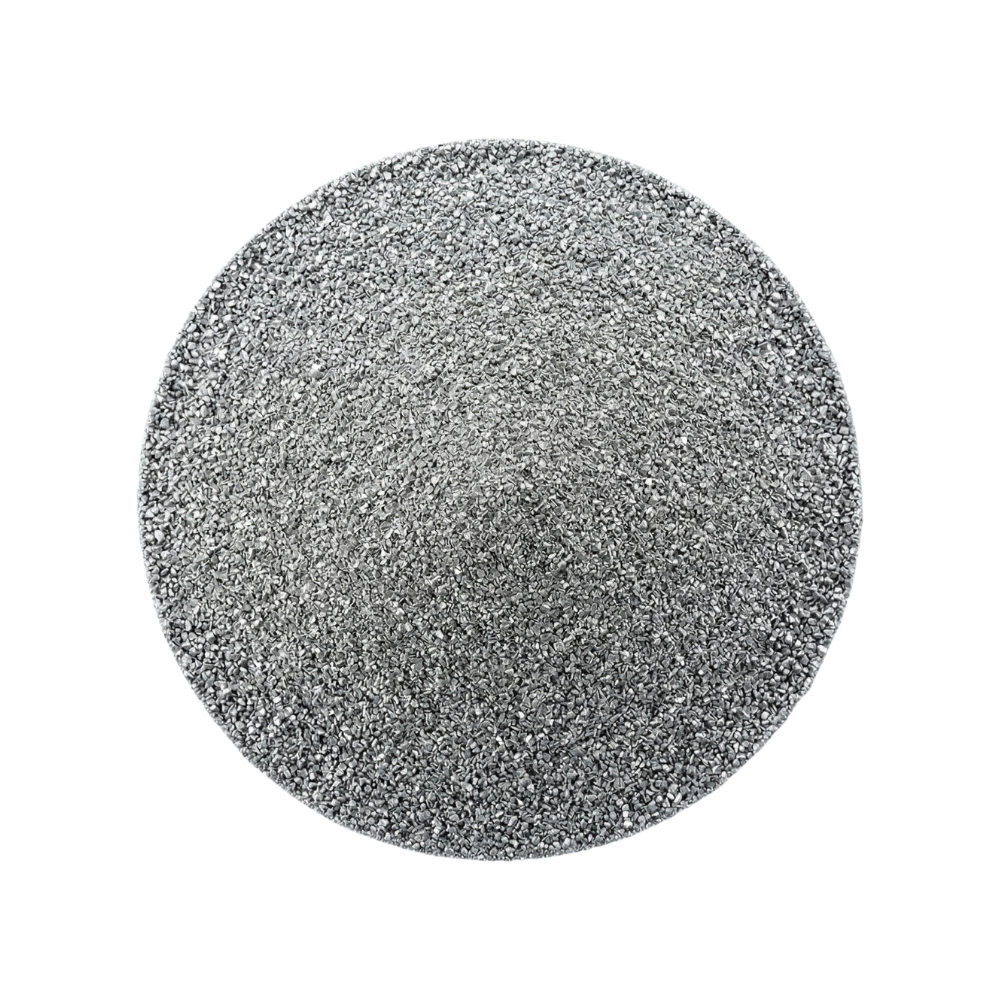 Round metallic object with a textured surface on a white background