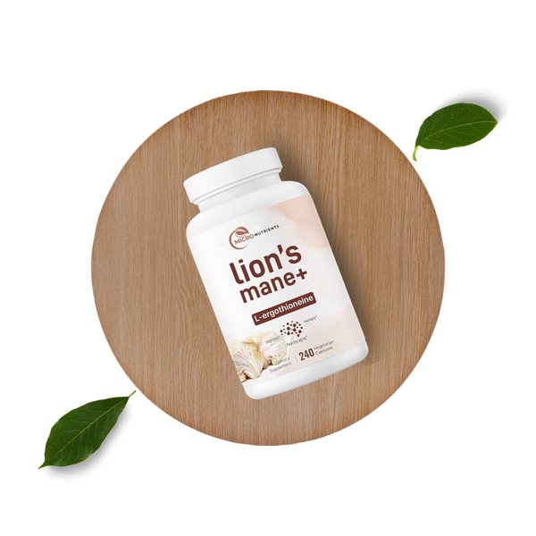 Lion's Mane supplement bottle on a wooden surface with leaves