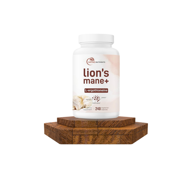 Supplement bottle labeled 'lion's mane+' on a wooden platform with a white background