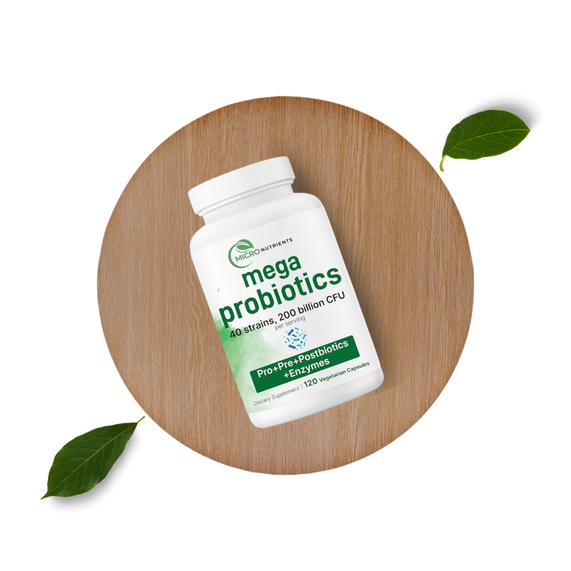 Mega Probiotics supplement bottle on a wooden board with leaves