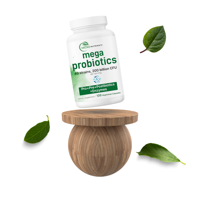 Mega Probiotics supplement bottle on a wooden stand with leaves around on a white background