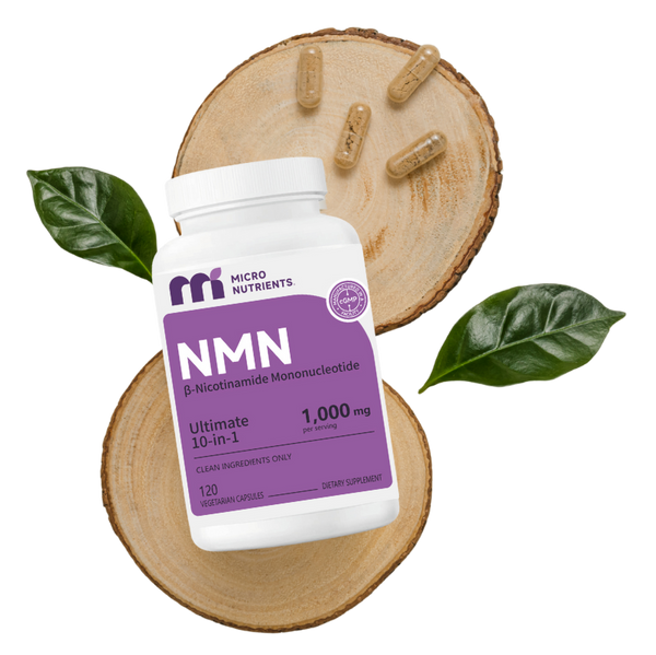 NMN supplement bottle with capsules on a wooden slice and leaves on a white background