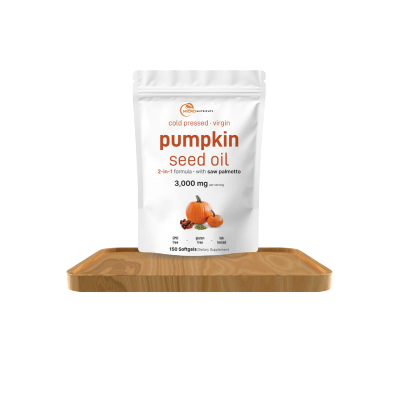 Bag of pumpkin seed oil on a wooden board with a white background