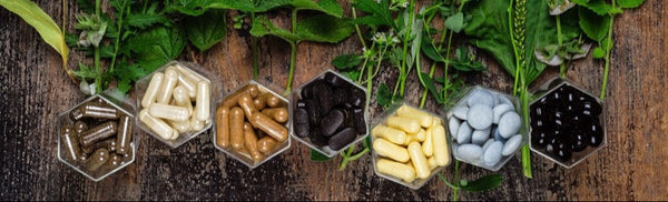 Herbal remedies and supplements on a wooden surface