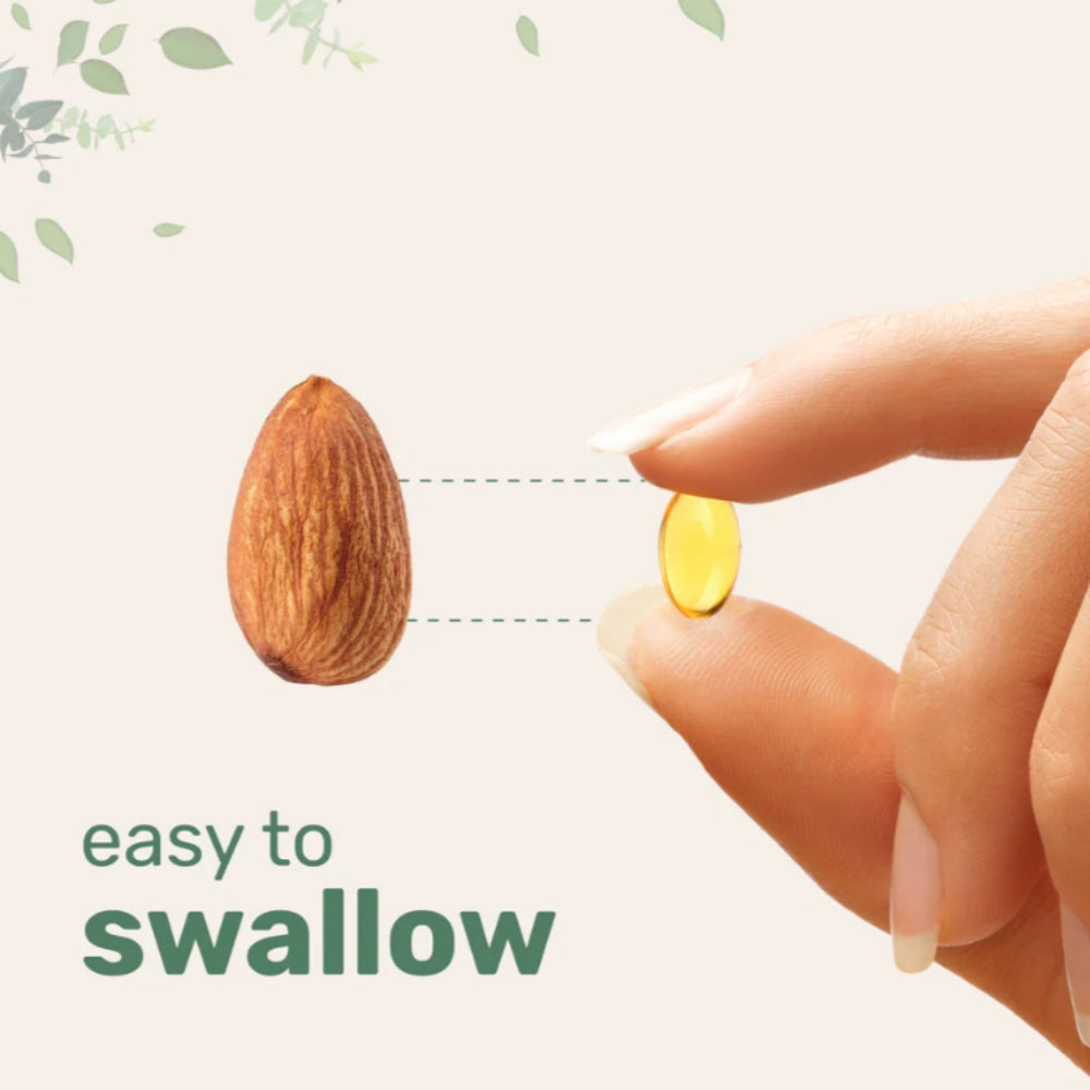 Vitamin supplement next to an almond with text 'easy to swallow' on a light background